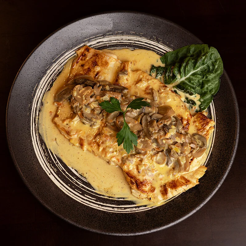 Pollo en salsa de champiñones